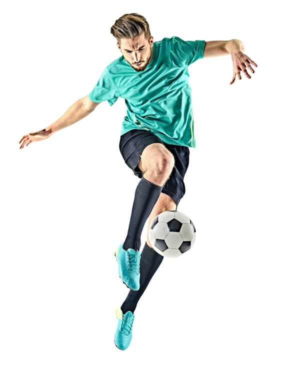 Soccer player in air kicking ball